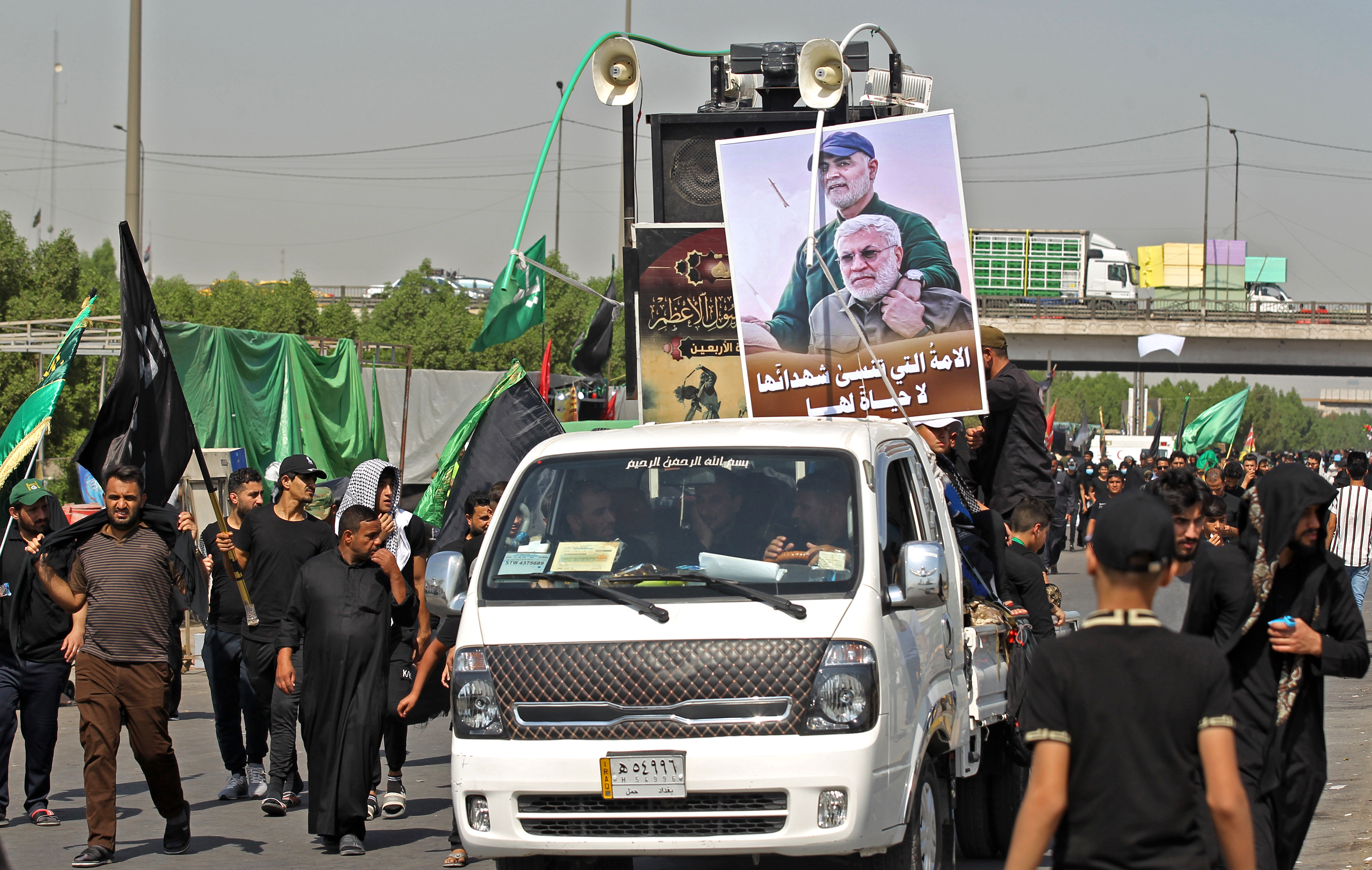 Iraqi Shia Muslim pilgrims walk at Baghdad's al-Dora area as they head to the holy city of Karbala to take part in Arbaeen, Oct. 5, 2020. (Photo: AFP/Mohammed Sawaf)